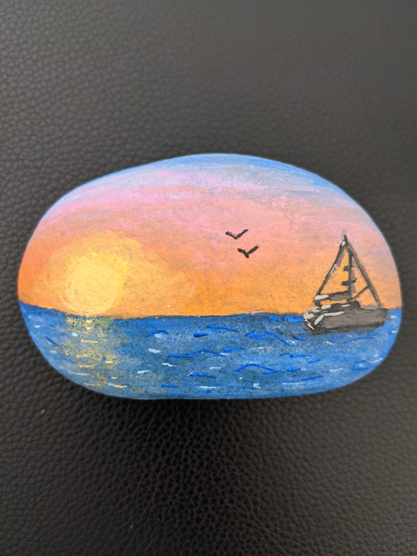 sunset painting on a stone